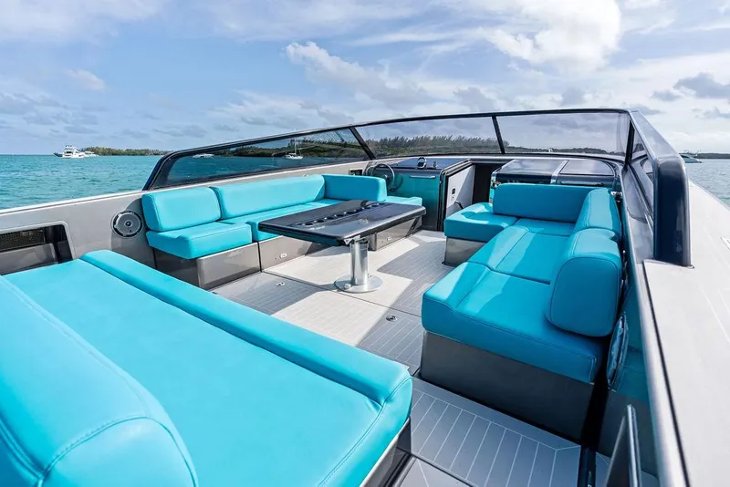 Slide: The Image of Luxurious 2015 VanDutch 55 yacht with turquoise seating and sleek design on open water. - 25