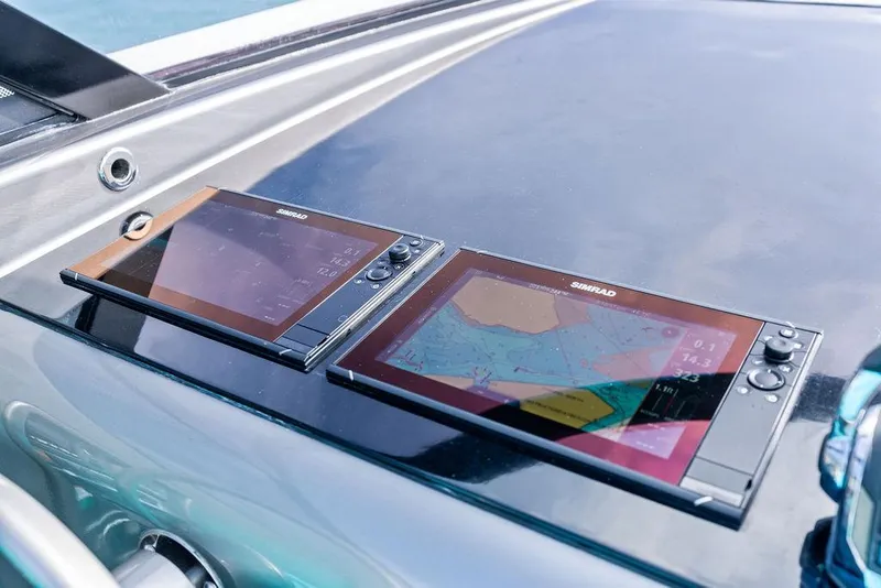 Slide: The Image of Navigation screens on a 2015 VanDutch 55 yacht dashboard. - 30