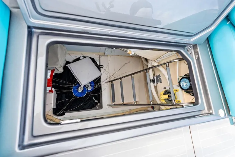 Slide: The Image of Interior storage compartment of a 2015 VanDutch 55 yacht, featuring a ladder and equipment. - 37