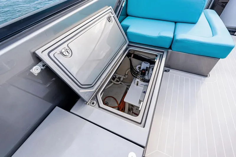 Slide: The Image of 2015 VanDutch 55 yacht with open storage compartment and blue seating. - 38