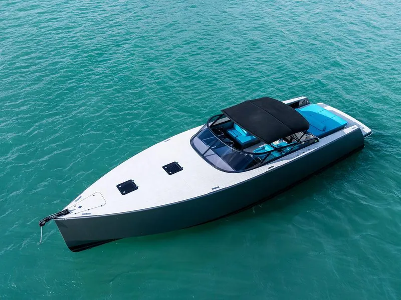 Slide: The Image of VanDutch 55 yacht, 2015 model, sleek design on turquoise water. - 4