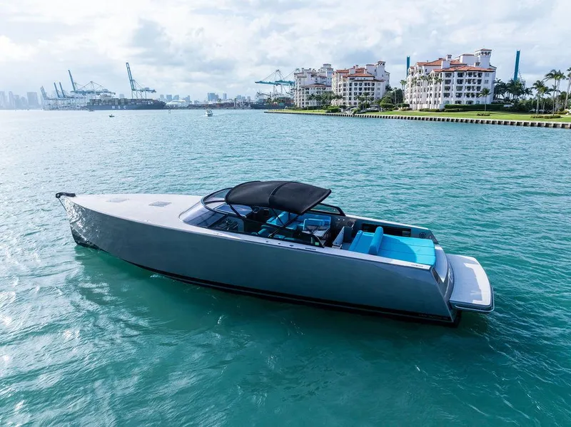 Slide: The Image of Luxury 2015 VanDutch 55 yacht on turquoise water near urban skyline. - 5