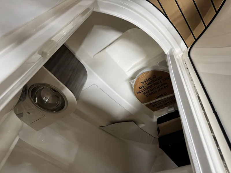 Slide: The Image of Interior view of 2026 Sea Ray SDX 250 Surf boat, featuring sleek design and modern amenities. - 17