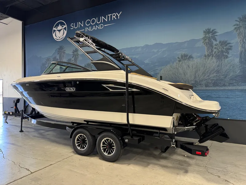 Slide: The Image of 2026 Sea Ray SDX 250 Surf boat on trailer at Sun Country Inland showroom. - 3