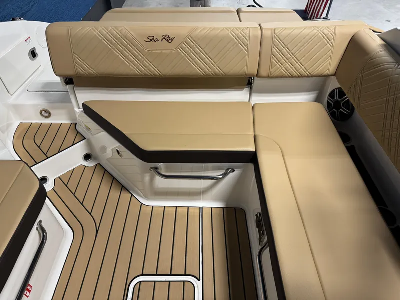 Slide: The Image of Luxurious interior seating of 2026 Sea Ray SDX 250 Surf boat with tan upholstery. - 7