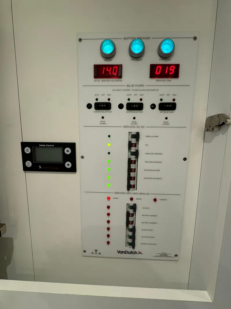 Slide: The Image of Control panel of a 2019 VanDutch 40 yacht, featuring digital displays and switches. - 10