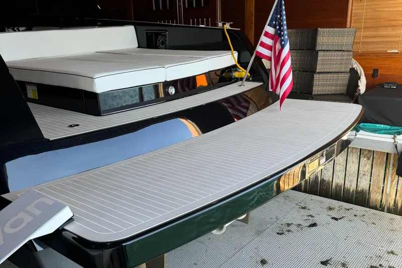 Slide: The Image of 2019 VanDutch 40 yacht with American flag, sleek design, and spacious deck. - 11