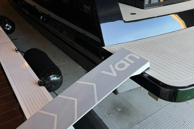 Slide: The Image of 2019 VanDutch 40 yacht, sleek design, luxury deck details, modern aesthetics. - 13