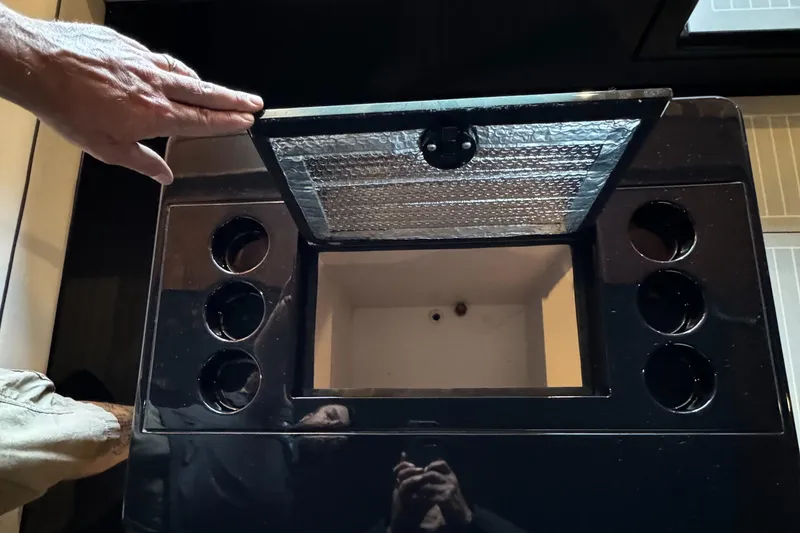 Slide: The Image of Control panel of a 2019 VanDutch 40 yacht with hand adjusting a component. - 15