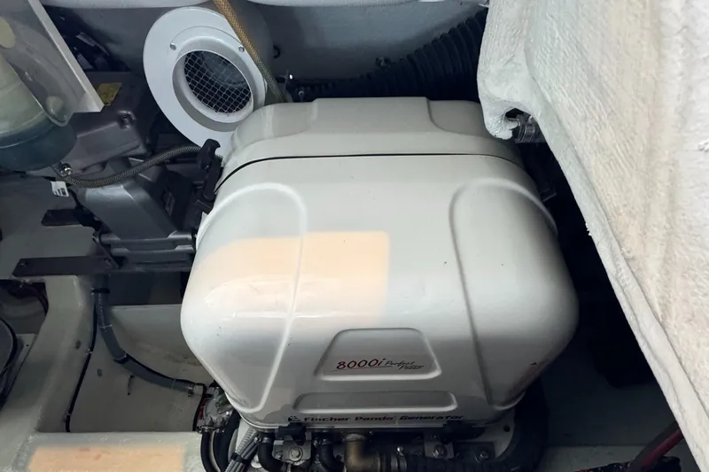 Slide: The Image of Engine compartment of a 2019 VanDutch 40 yacht, featuring a generator. - 18