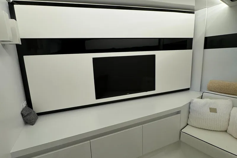 Slide: The Image of Modern interior of 2019 VanDutch 40 yacht with sleek TV setup and cozy seating. - 21