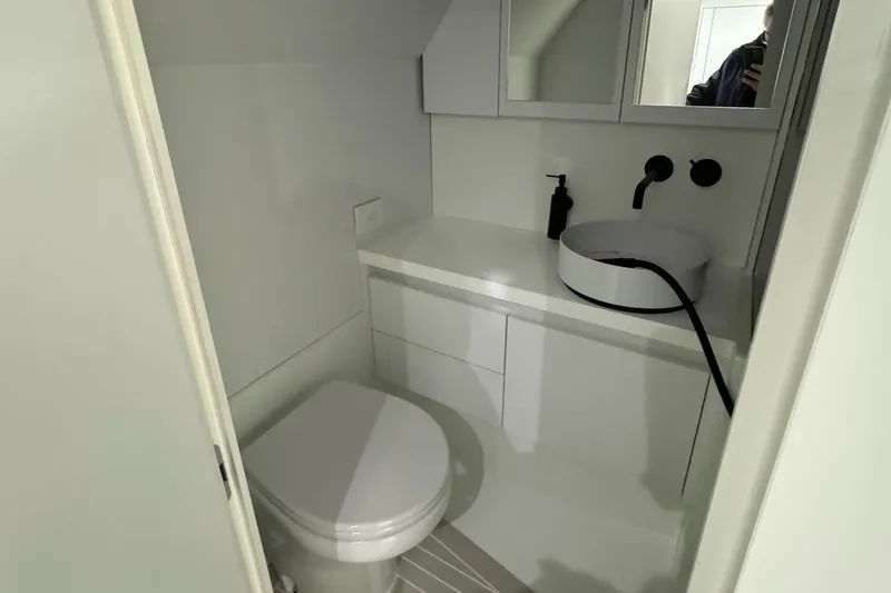 Slide: The Image of Modern bathroom in 2019 VanDutch 40 yacht with sleek white fixtures and minimalist design. - 23