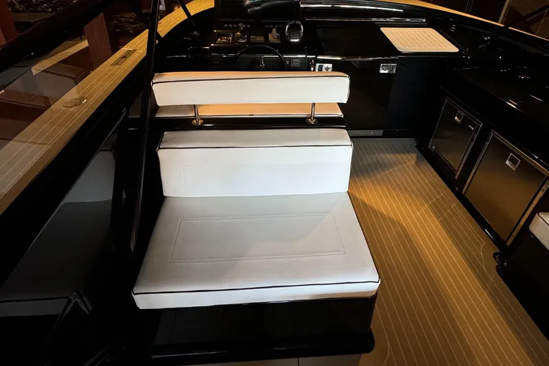 Slide: The Image of VanDutch 40 yacht interior, 2019 model, featuring sleek black and white seating and modern design. - 25