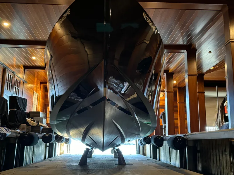 Slide: The Image of 2019 VanDutch 40 yacht in a wooden boathouse, viewed from the front. - 5