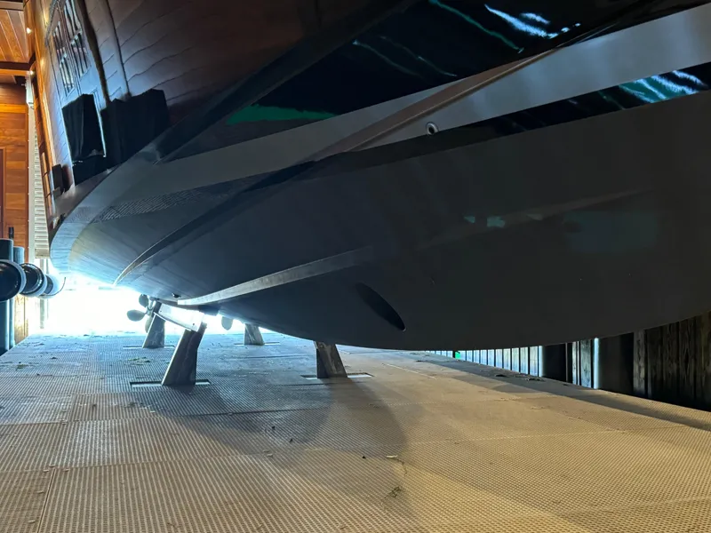 Slide: The Image of 2019 VanDutch 40 yacht hull in dry dock, showcasing sleek design and craftsmanship. - 6
