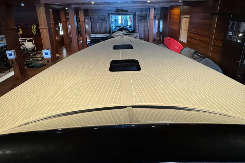 Slide: The Image of 2019 VanDutch 40 yacht in a wooden interior showroom, showcasing sleek design and craftsmanship. - 8