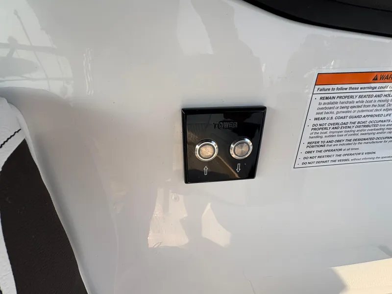 Slide: The Image of Control panel on 2026 Sea Ray SLX 260 boat with warning label. - 12