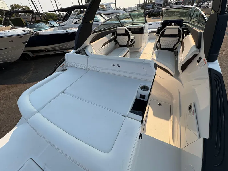 Slide: The Image of 2026 Sea Ray SLX 260 boat interior with luxurious white seating and modern design. - 4