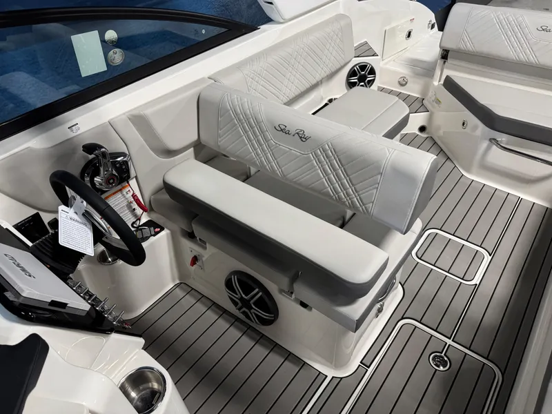 Slide: The Image of 2026 Sea Ray SDX 270 boat interior with luxurious seating and modern dashboard. - 13