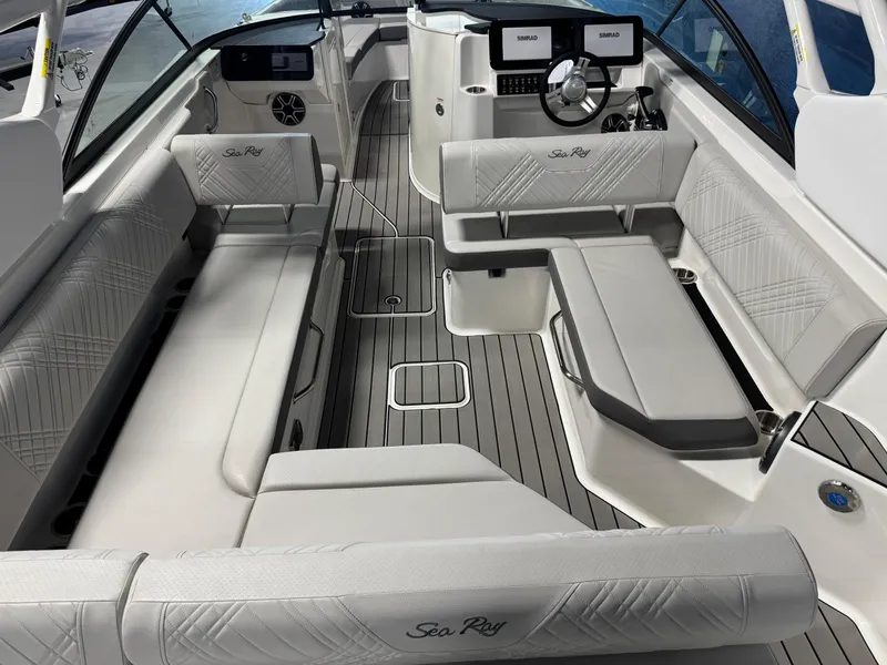Slide: The Image of 2026 Sea Ray SDX 270 boat interior with luxurious seating and modern dashboard. - 6