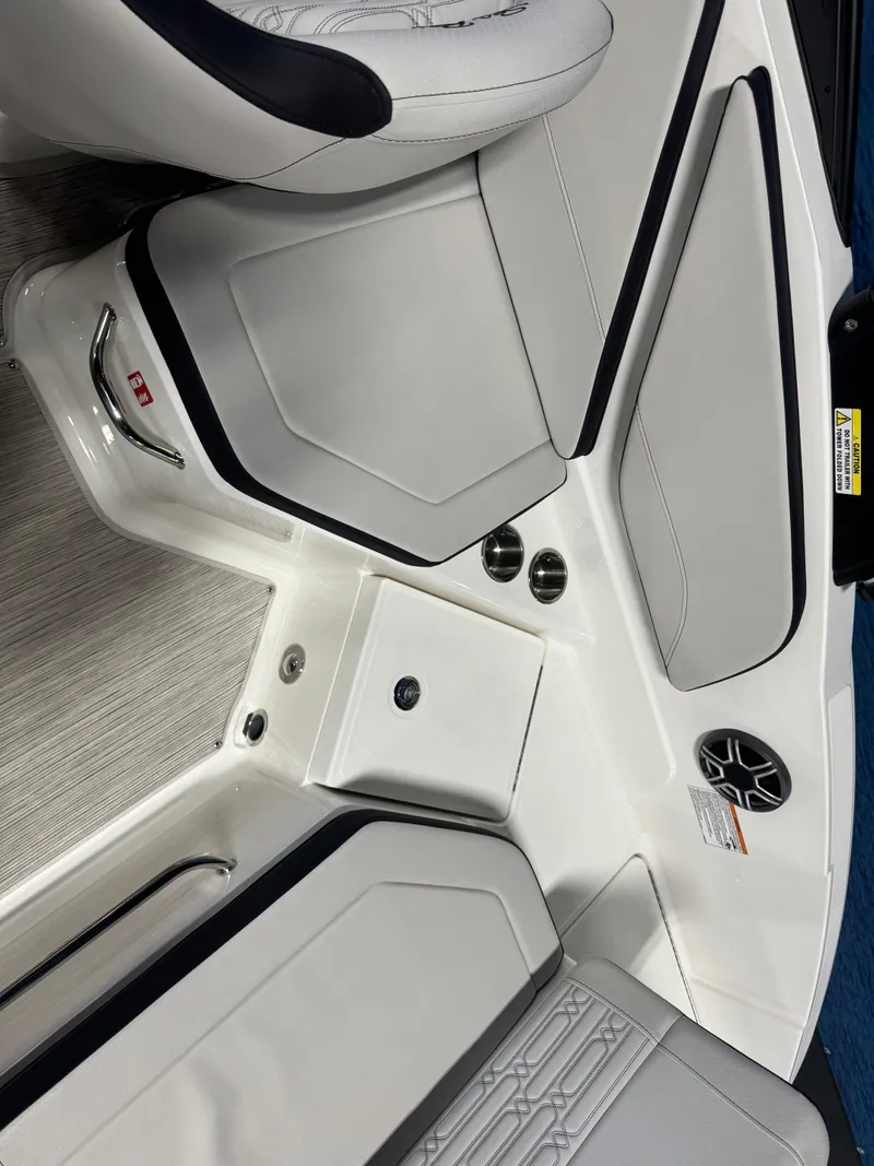 Slide: The Image of Interior of 2026 Sea Ray SPX 210 boat with white seating and modern design. - 10