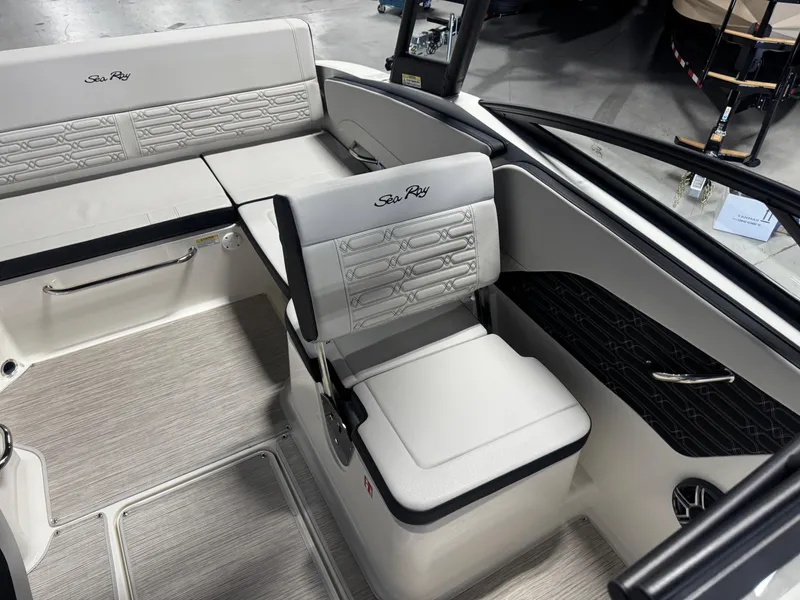 Slide: The Image of 2026 Sea Ray SPX 210 boat interior with white seating and modern design. - 12