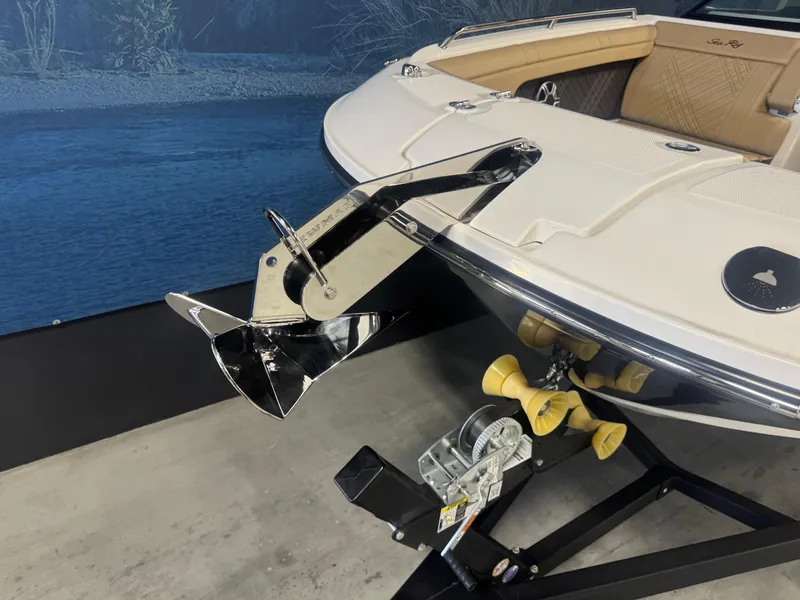 Slide: The Image of 2026 Sea Ray SDX 290 boat with anchor on display in showroom. - 19