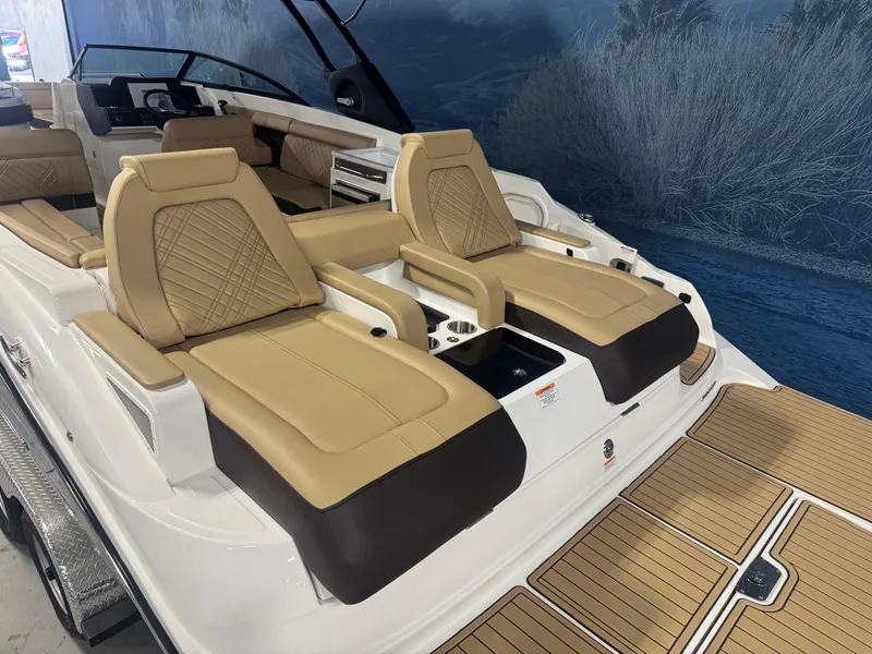 Slide: The Image of 2026 Sea Ray SDX 290 boat with luxurious tan seating and sleek design. - 5