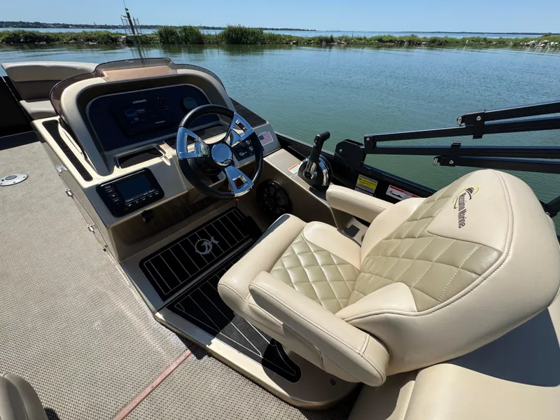 Slide: The Image of Luxurious 2023 Massimo Marine P24 boat cockpit with plush seating and modern controls. - 16