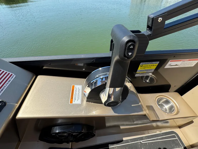 Slide: The Image of Control panel of 2023 Massimo Marine P24 boat with throttle lever and cup holder. - 23