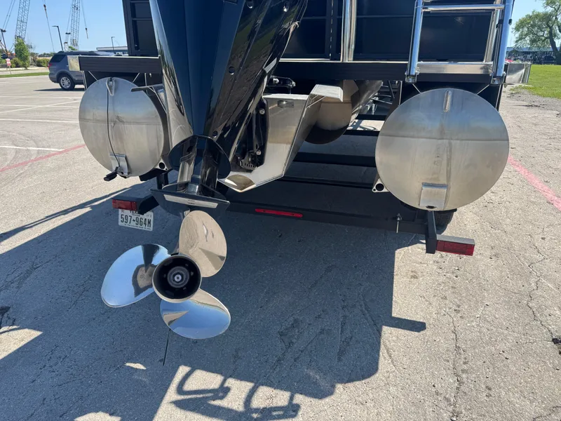 Slide: The Image of Rear view of 2023 Massimo Marine P24 boat with propeller and pontoons. - 8