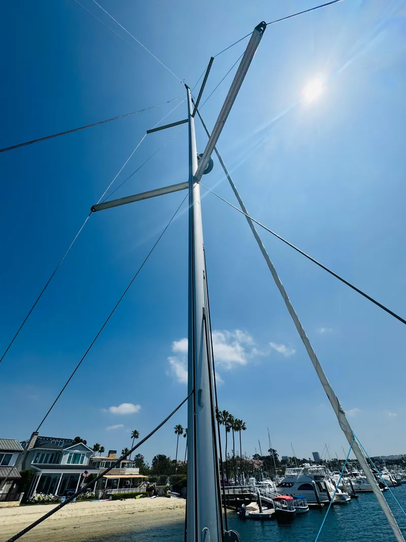 Slide: The Image of Sailboat mast of 2020 Beneteau Oceanis 41.1 under clear blue sky at marina. - 10