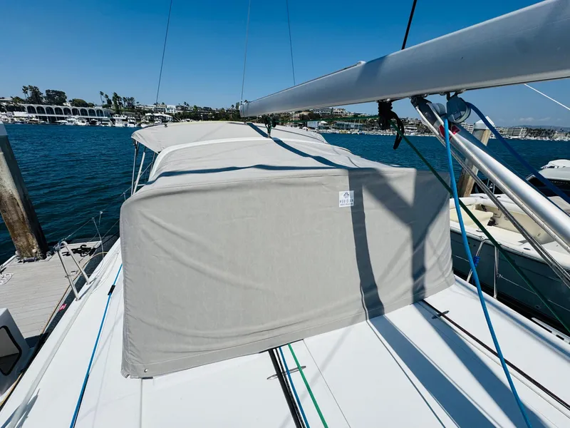 Slide: The Image of 2020 Beneteau Oceanis 41.1 sailboat with covered deck, docked in a marina. - 12