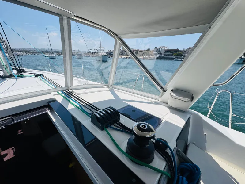 Slide: The Image of Cockpit view of 2020 Beneteau Oceanis 41.1 sailboat in a marina setting. - 15