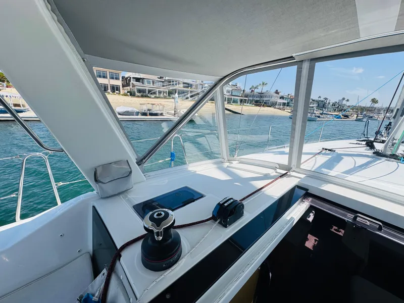 Slide: The Image of Cockpit view of 2020 Beneteau Oceanis 41.1 sailboat, docked near waterfront homes. - 16