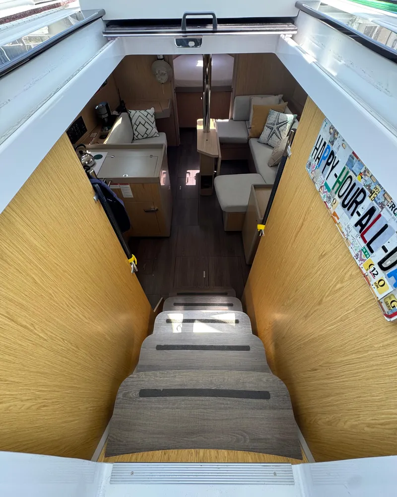 Slide: The Image of Interior view of 2020 Beneteau Oceanis 41.1 yacht, featuring cozy seating and modern design. - 25