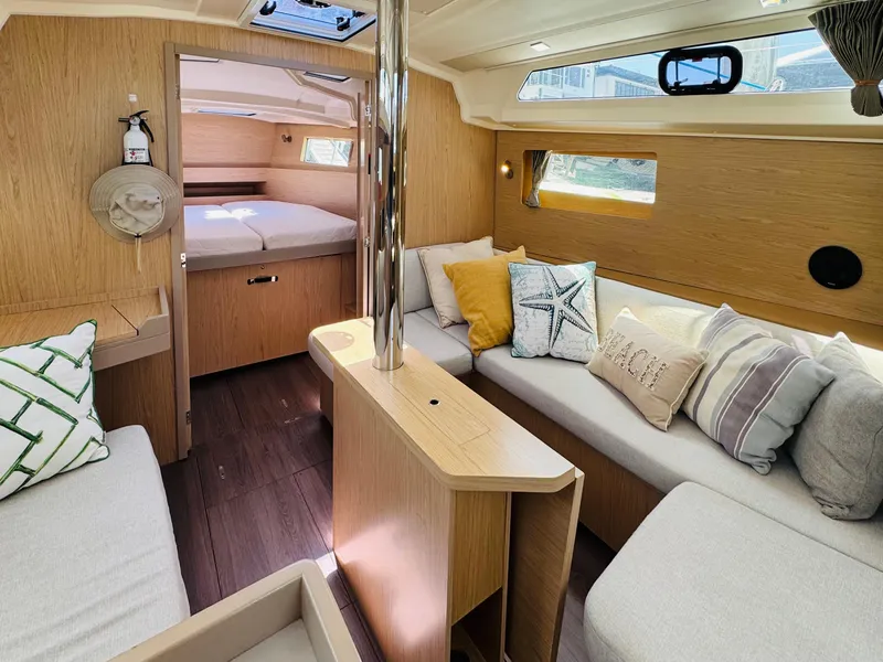 Slide: The Image of Interior of 2020 Beneteau Oceanis 41.1 yacht, featuring cozy seating and stylish decor. - 29