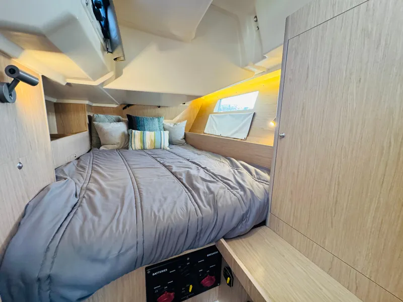 Slide: The Image of Cozy cabin interior of 2020 Beneteau Oceanis 41.1 sailboat with comfortable bedding. - 40