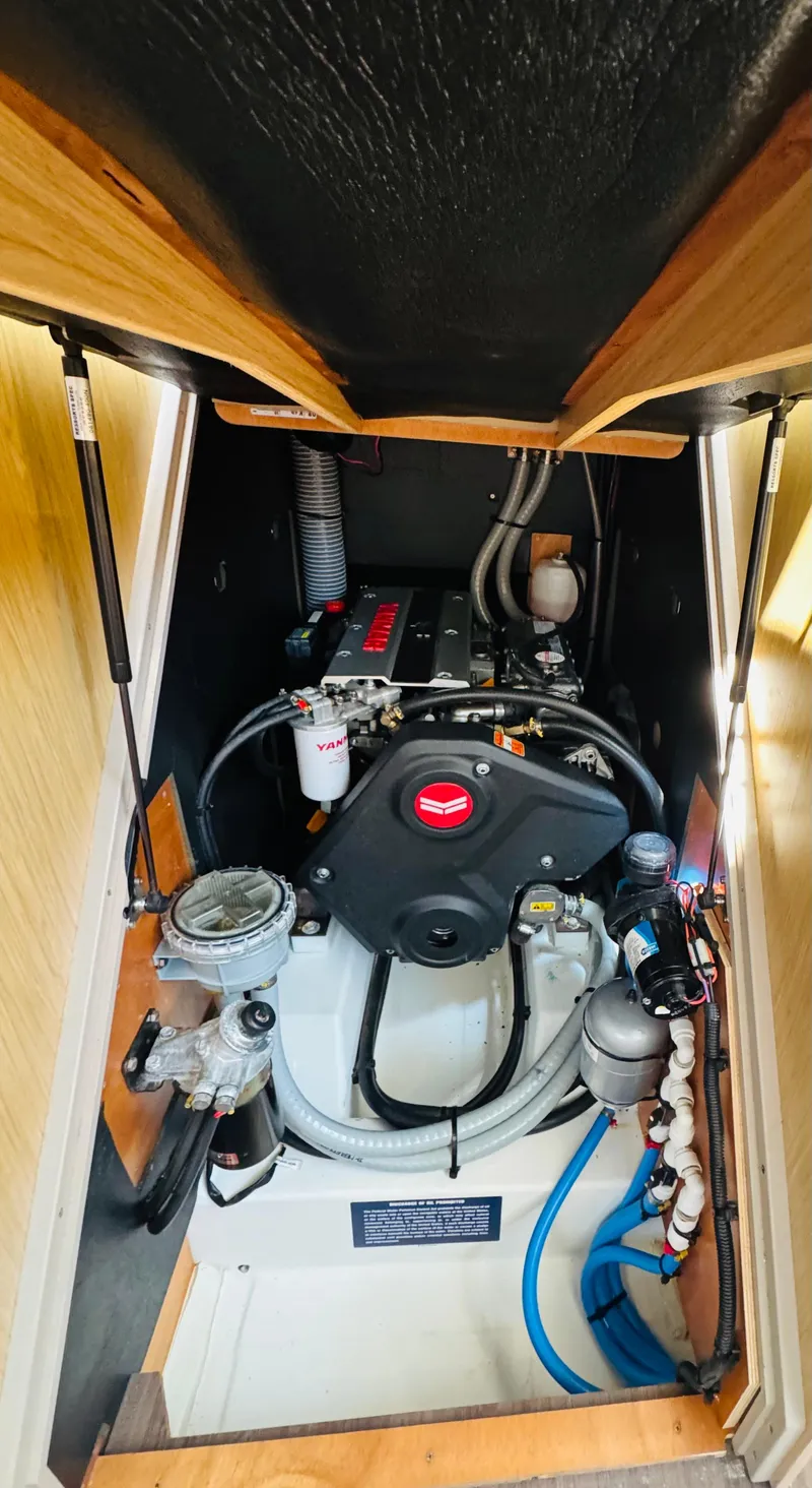 Slide: The Image of Engine compartment of a 2020 Beneteau Oceanis 41.1 sailboat, showcasing mechanical components. - 46