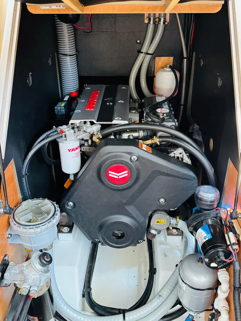 Slide: The Image of Engine room of 2020 Beneteau Oceanis 41.1 sailboat, featuring Yanmar engine components. - 47