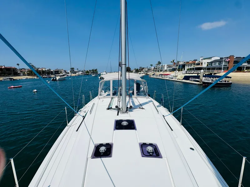 Slide: The Image of Beneteau Oceanis 41.1 sailboat cruising in a scenic harbor, 2020 model. - 5