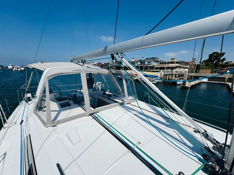 Slide: The Image of Sailing yacht Beneteau Oceanis 41.1, 2020 model, docked in a marina under clear blue skies. - 6