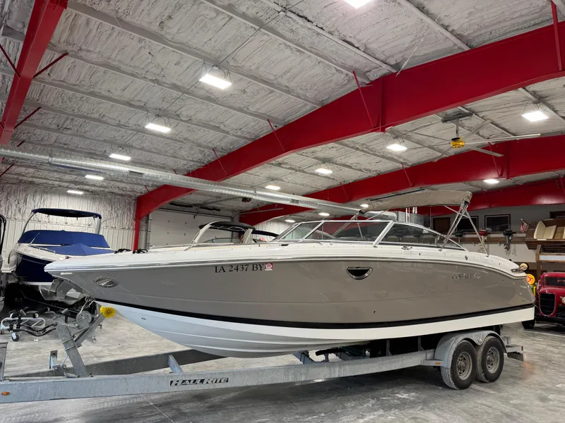 The Image of 2012 Cobalt 296 BR boat on trailer in indoor storage facility. - 1