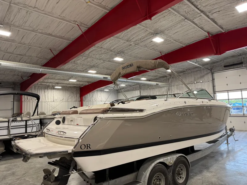 Slide: The Image of 2012 Cobalt 296 BR boat on trailer in indoor storage facility. - 4