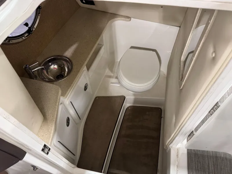 Slide: The Image of 2012 Cobalt 296 BR boat interior with sink and toilet. - 9