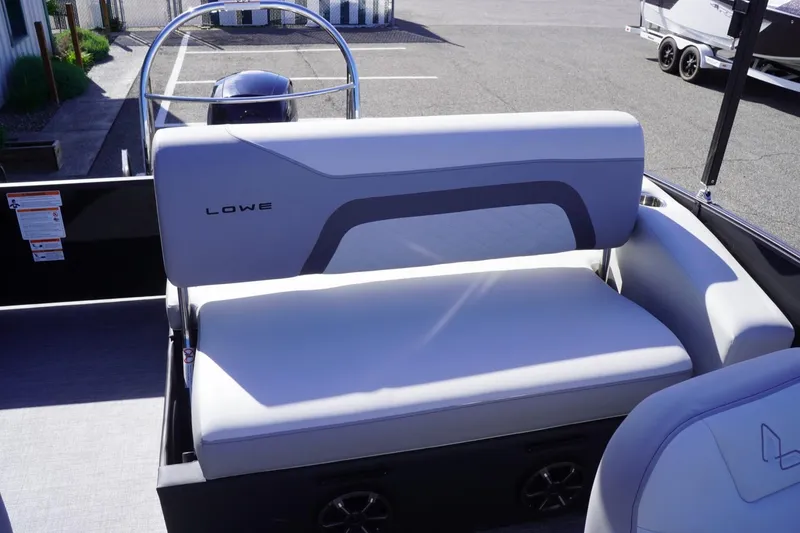 Slide: The Image of 2025 Lowe SS 230 DL boat interior with gray seating and modern design. - 24