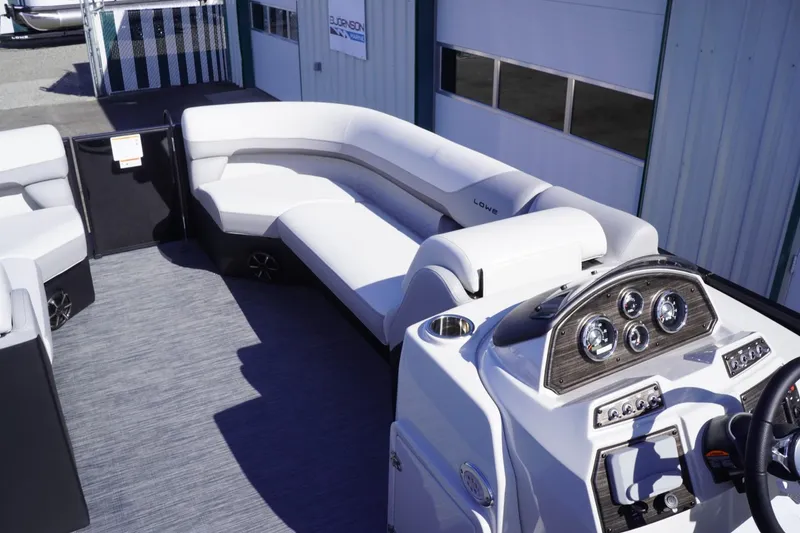 Slide: The Image of 2025 Lowe SS 230 DL pontoon boat interior with modern seating and control panel. - 30