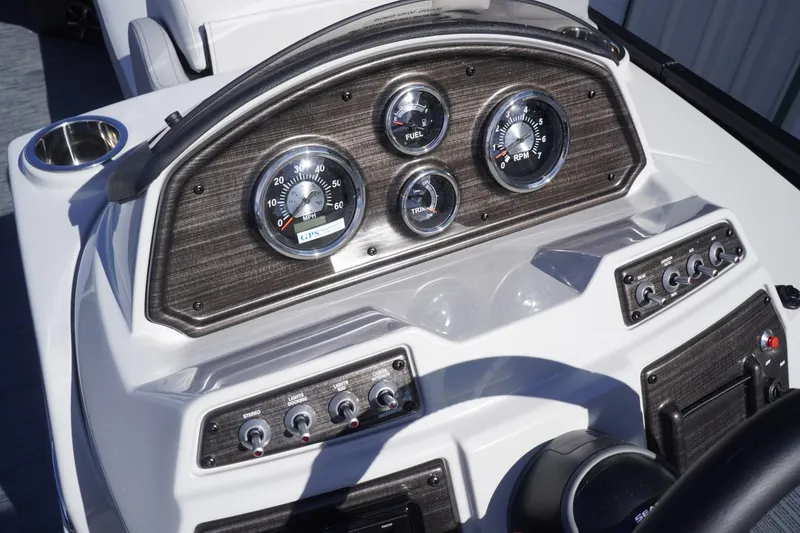 Slide: The Image of Dashboard of 2025 Lowe SS 230 DL boat with gauges and controls. - 33