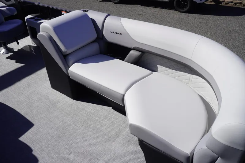 Slide: The Image of Luxurious seating on 2025 Lowe SS 230 DL pontoon boat, featuring sleek white upholstery. - 41