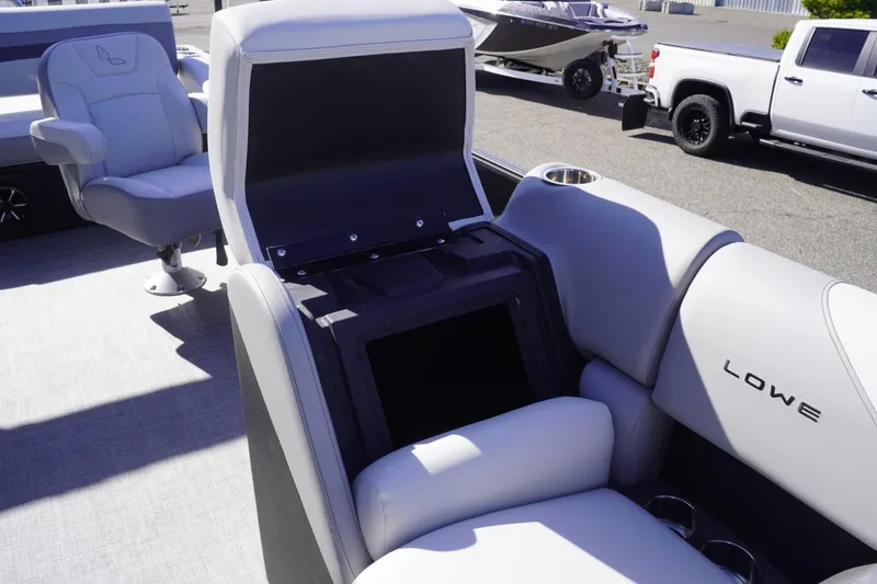 Slide: The Image of 2025 Lowe SS 230 DL boat interior with open storage compartment and seating. - 44